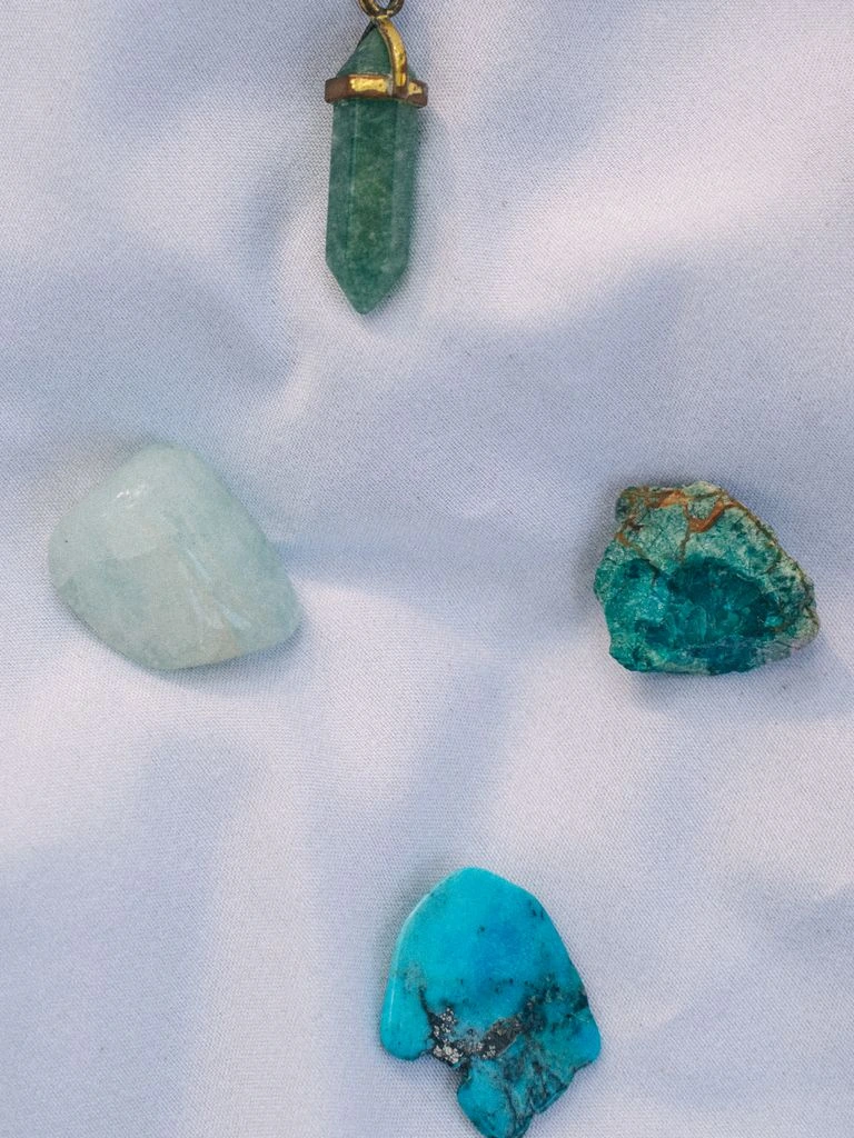 A step-cut aquamarine of approximately eight carats on dark velvet