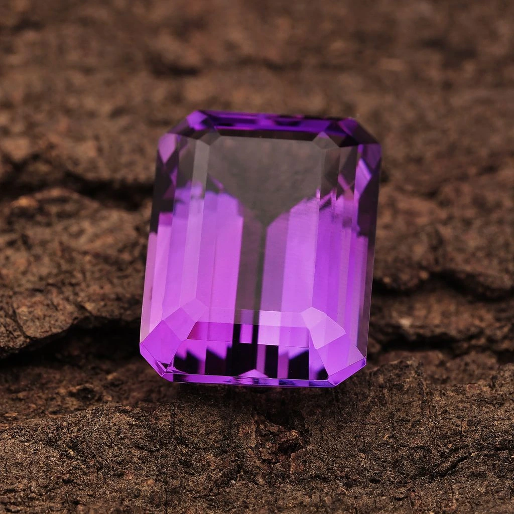An emerald-cut aquamarine of 7.15 carats on midnight velvet.