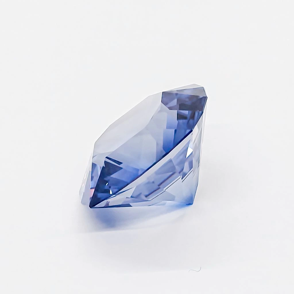 A cushion-cut aquamarine of 11.06 carats on warm parchment velvet.