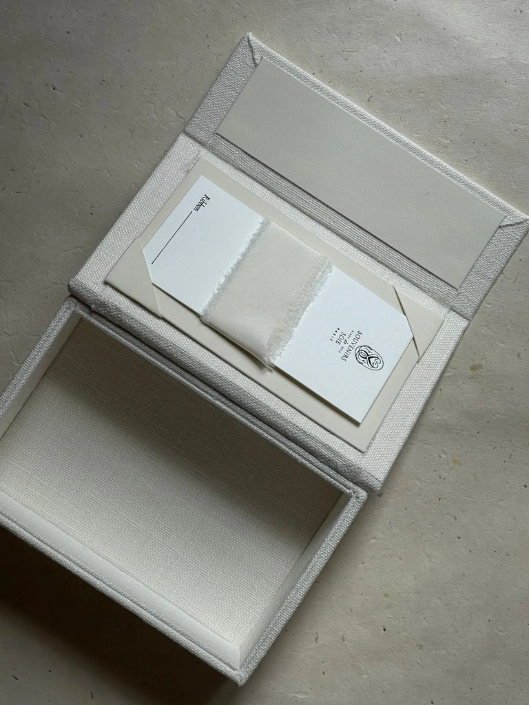 Trade certificate of authenticity beside an aquamarine stone